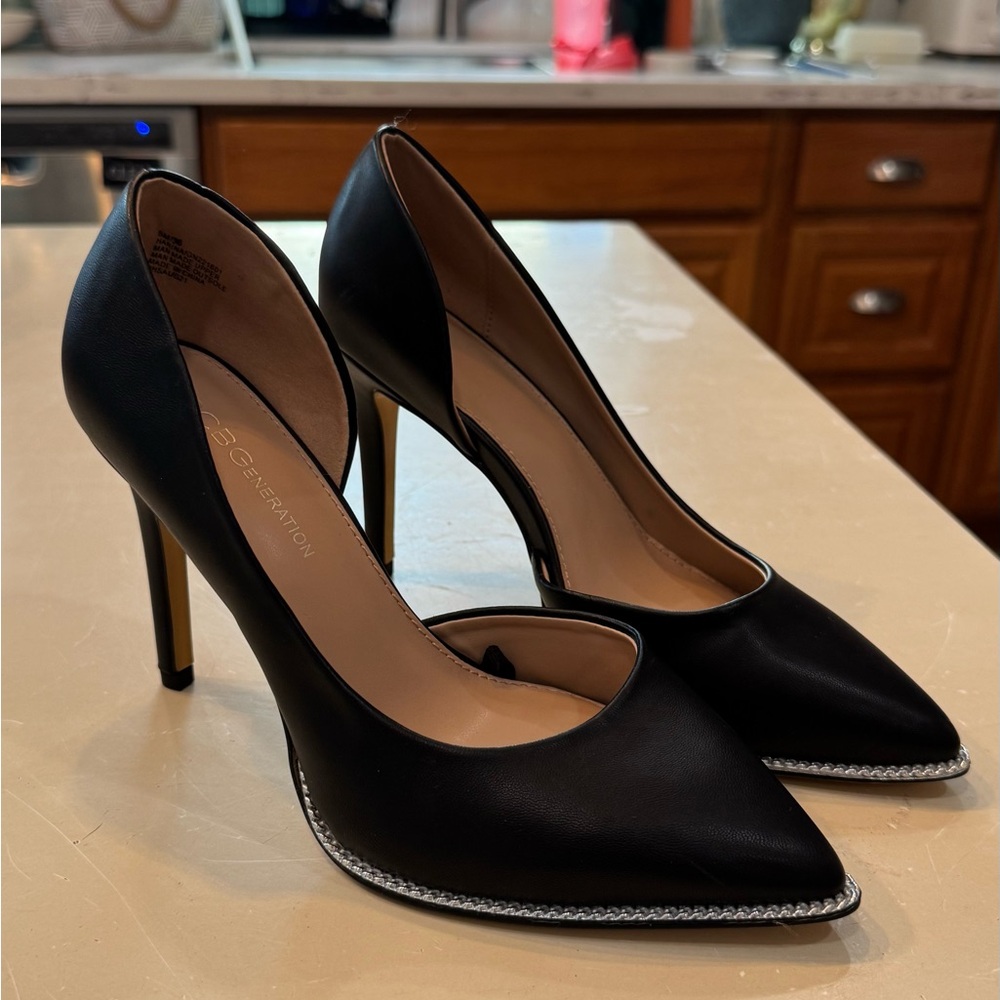 BCBGeneration Black Pointed-Toe Stiletto Pumps with Silver Chain Edge